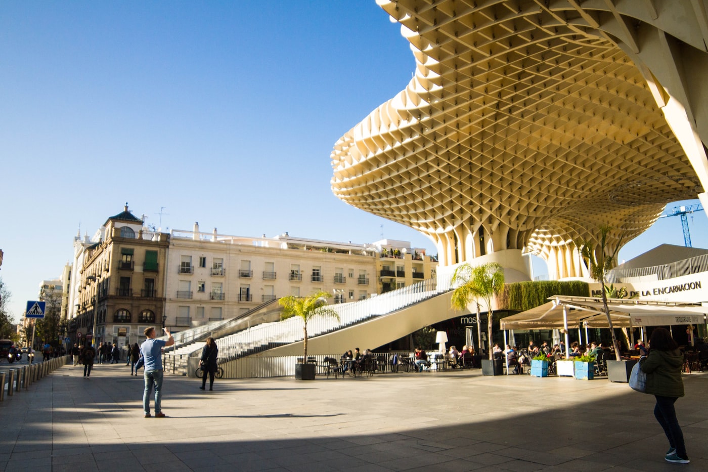 People gathering in a Seville plaza